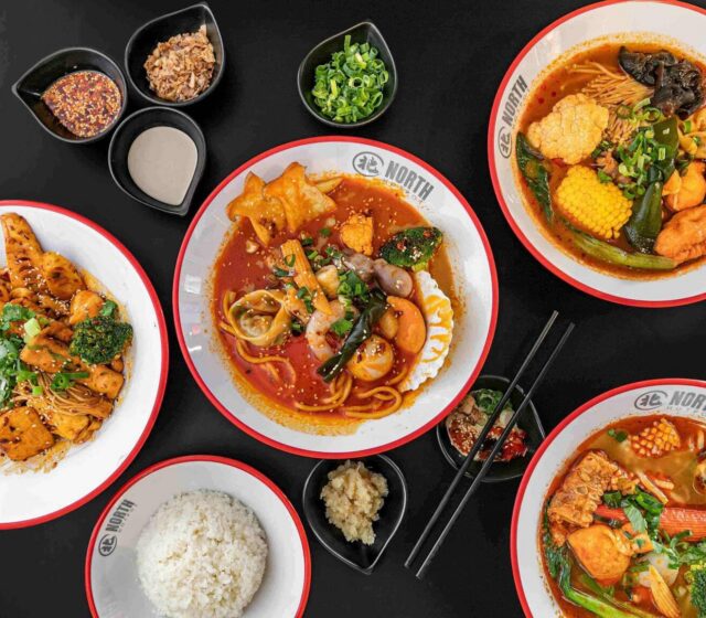 A North Hot Pot spread of noodle bowls, sauces and rice